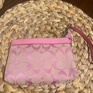 Light pink coach wristlet. Great condition